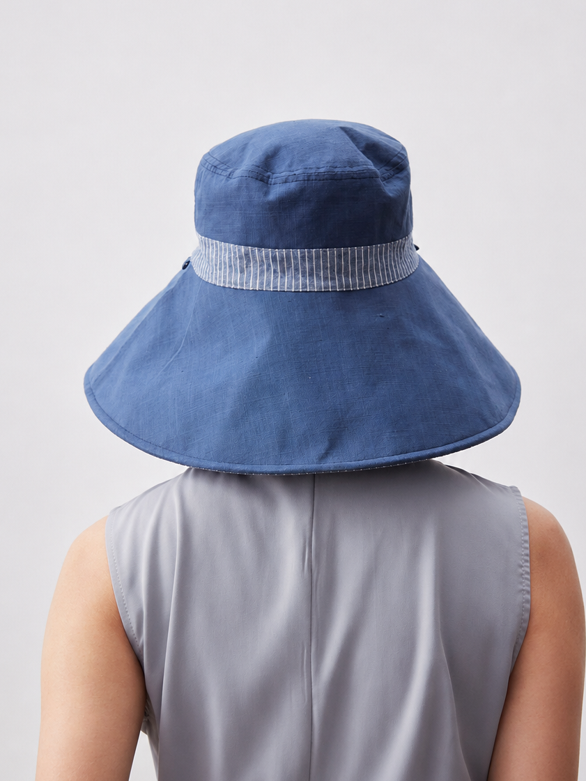 Margo & Main – Carmela blue reversible wide-brim bucket sun hat from the back, striped band wrapping the crown