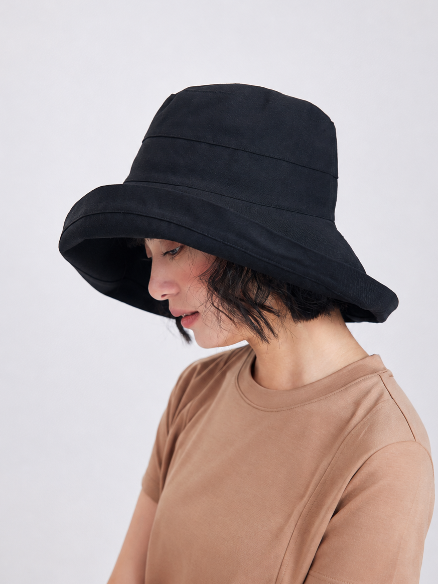 Margo & Main – Elke black wide-brim foldable sun hat in side profile, showing the deep downward brim