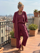 Margo & Main – Yael burgundy duster pant set, walking view on a terrace, US women's sizes