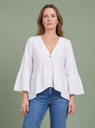 Melba Lane - white bell sleeve V neck blouse, full length studio view, AU women's sizes