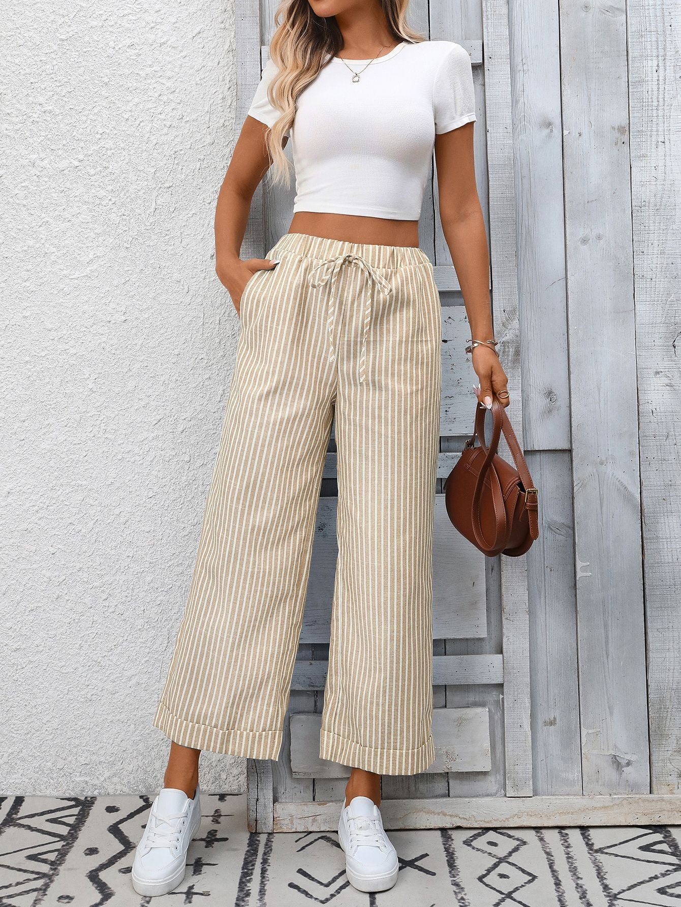 Margo & Main – Cosetta sand beige striped cropped wide-leg pants, front view standing against a white wall, US women's sizes