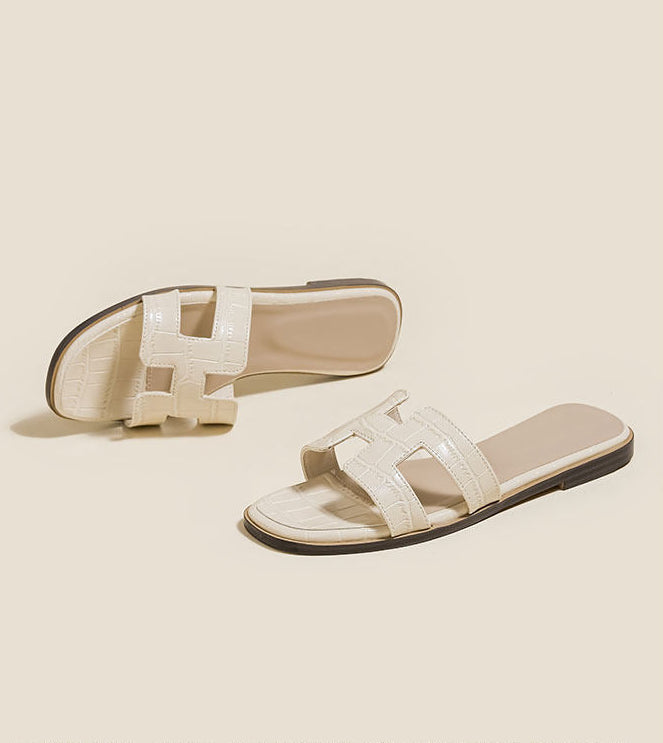 Margo & Main – Manon cream croc-embossed H-strap slide sandals, pair angled on a plain background, US women's sizes
