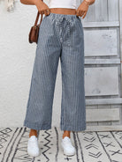 Margo & Main – Cosetta denim blue striped cropped wide-leg pants, front view styled with a brown shoulder bag, US women's sizes