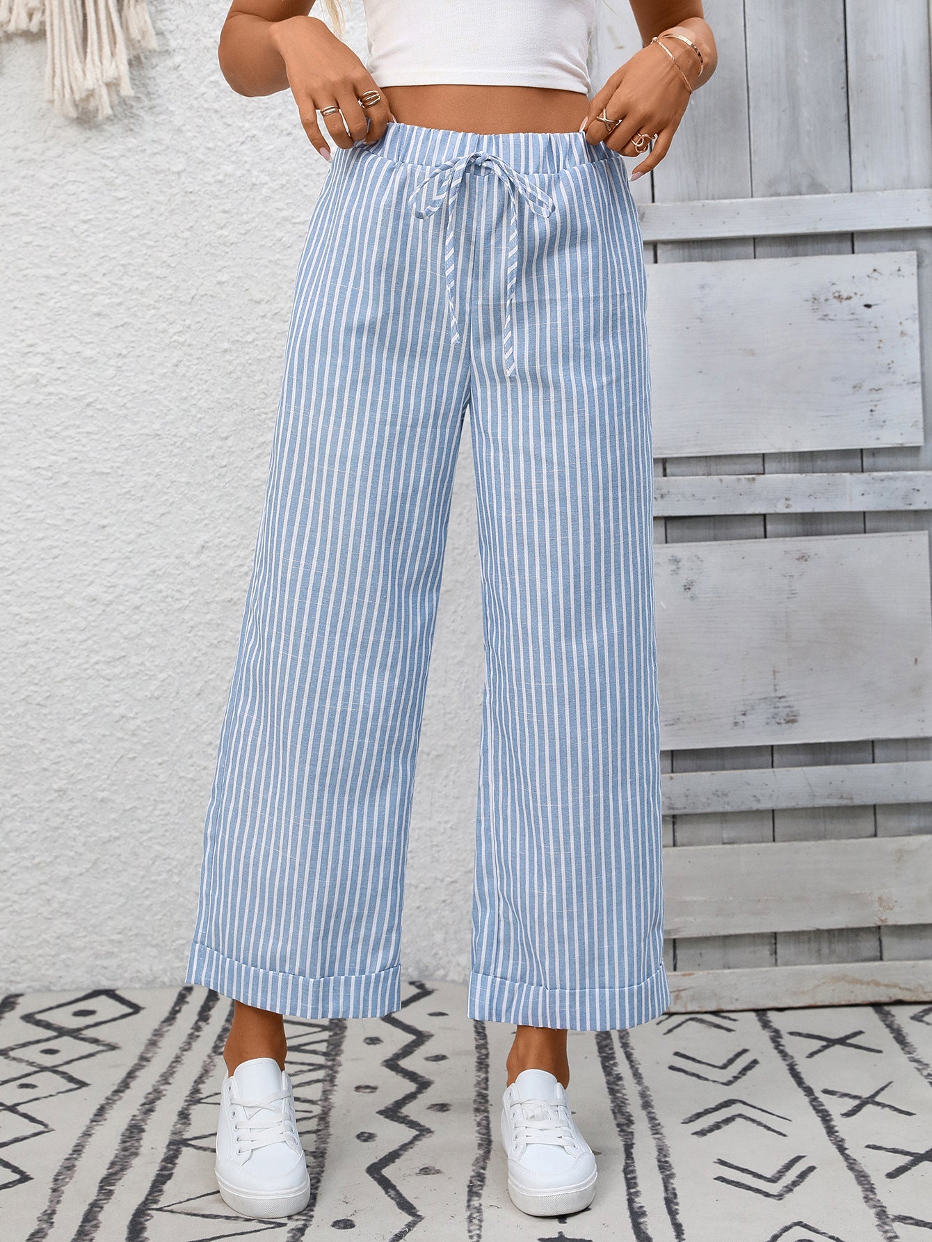 Margo & Main – Cosetta light blue striped cropped wide-leg pants, front view with hands at the waistband, US women's sizes