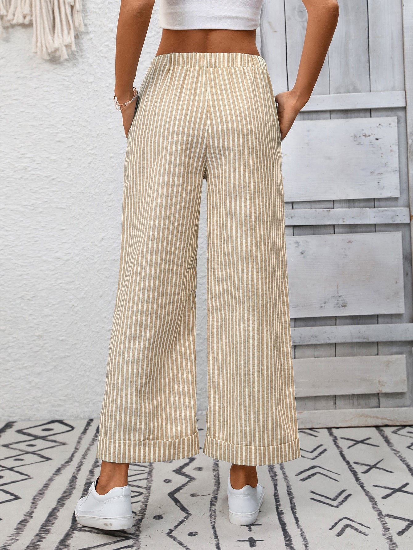 Margo & Main – Cosetta sand beige striped cropped wide-leg pants, back view with hands in the pockets, US women's sizes