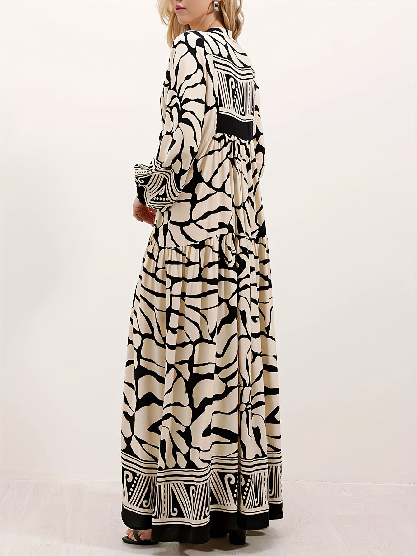 Margo & Main – cream and black print maxi dress worn with a clutch bag, US women's sizes