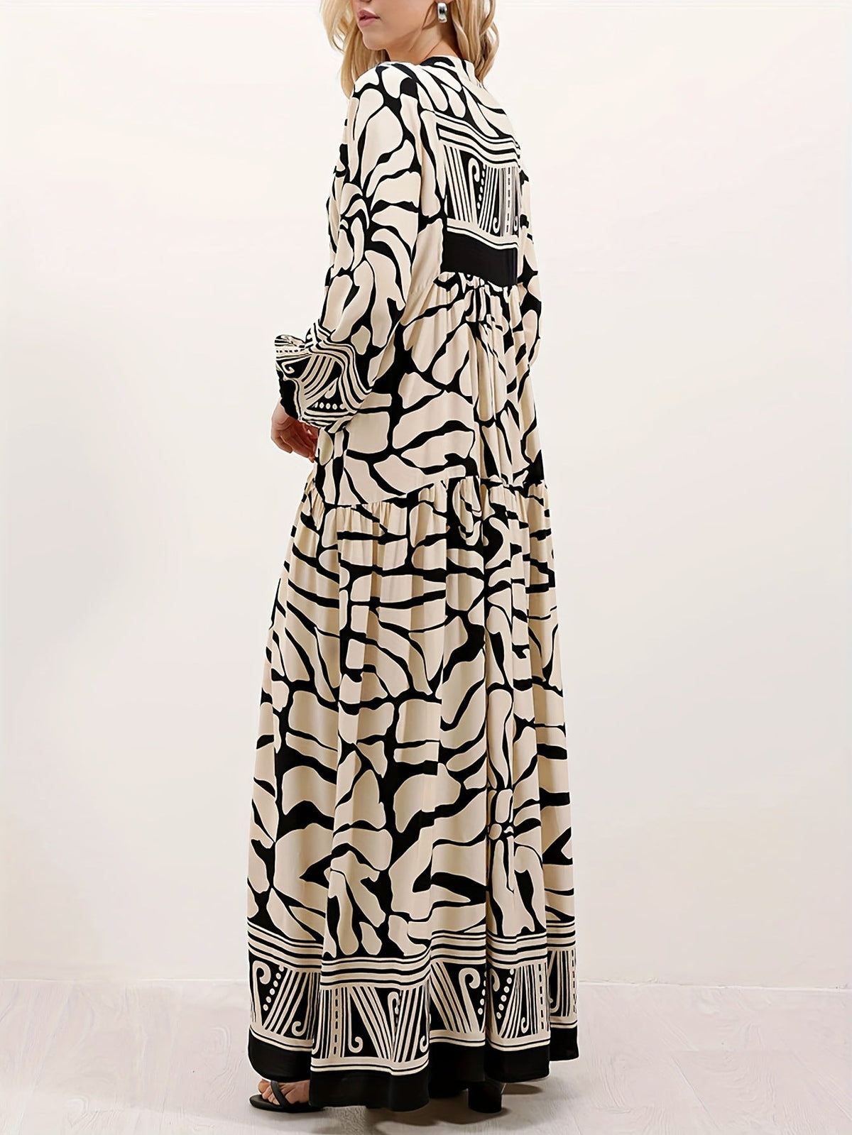 Margo & Main – cream and black print maxi dress worn with a clutch bag, US women's sizes