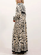 Margo & Main – cream and black print maxi dress worn with a clutch bag, US women's sizes
