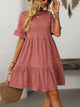 Margo & Main – Vianne dusty rose textured tiered short-sleeve dress, front view with a straw tote held low, US women's sizes