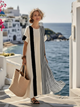 Margo & Main – Isolde cream striped maxi dress, full length front view by the sea, US women's sizes