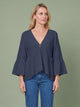 Melba Lane - navy bell sleeve V neck blouse, full length studio view, AU women's sizes