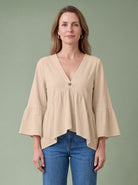 Melba Lane - orange bell sleeve V neck blouse, full length studio view, AU women's sizes