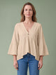 Melba Lane - orange bell sleeve V neck blouse, full length studio view, AU women's sizes