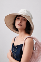 Margo & Main – Carmela beige reversible wide-brim bucket sun hat, front view with the striped band at the crown