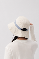 Margo & Main – Sabella light blue reversible bucket sun hat from the back, showing the split brim and adjustable back tab