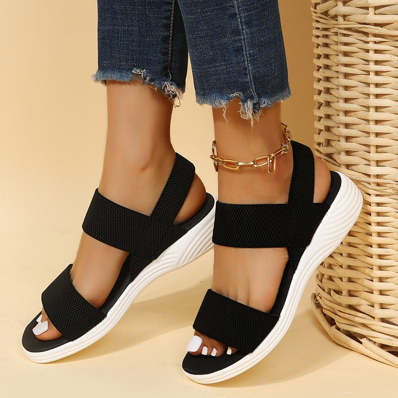 Melba Lane - black stretch strap platform sandals, worn side view with jeans, AU women's sizes