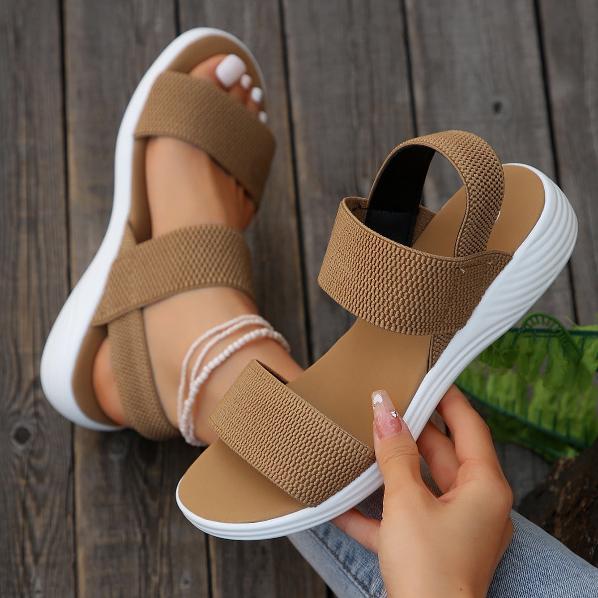 Melba Lane - tan stretch strap platform sandals worn with jeans, pair held in hand, AU women's sizes