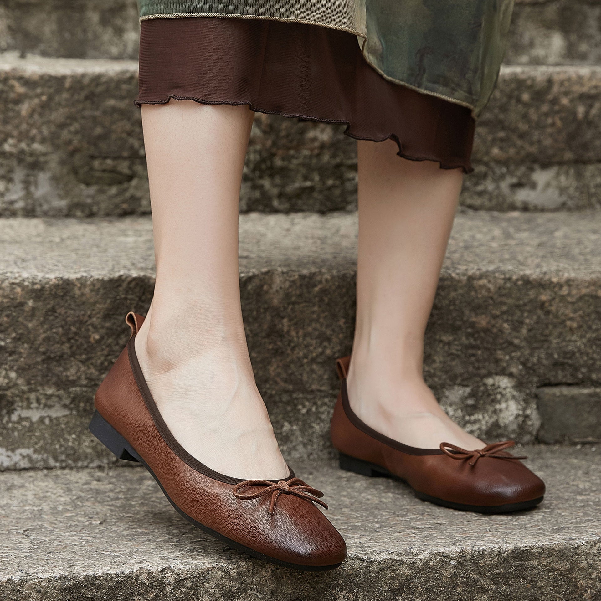 Melba Lane - brown and cream sheepskin bow ballet flats, worn on steps, AU women's sizes