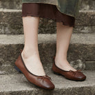 Melba Lane - brown and cream sheepskin bow ballet flats, worn on steps, AU women's sizes